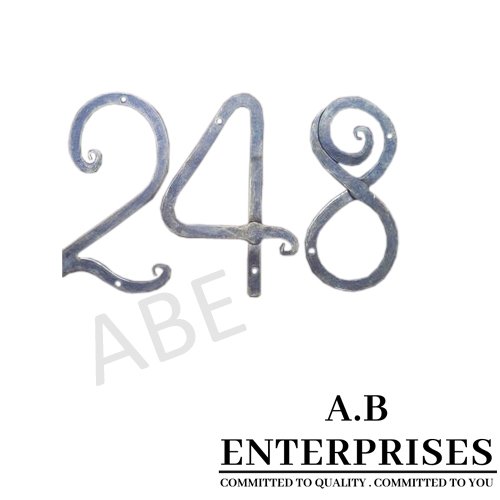 Handcrafted numeral in handforged iron with natural patina finish by A.B. Enterprises, India.