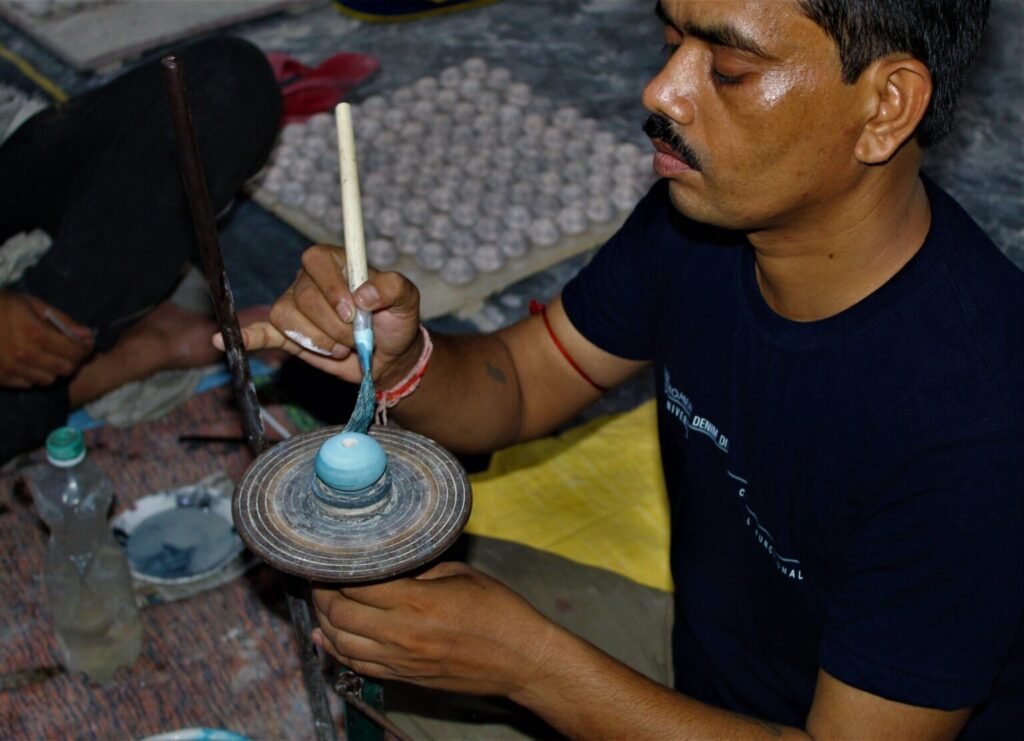 Skilled artisans crafting decorative hardware at A.B. Enterprises factory